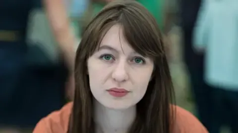 Irish author Sally Rooney states she is unable to visit the UK because of legal concerns